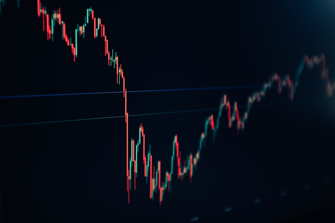 candlestick-stock-chart-on-dark-screen-vlpwpv3odb4
